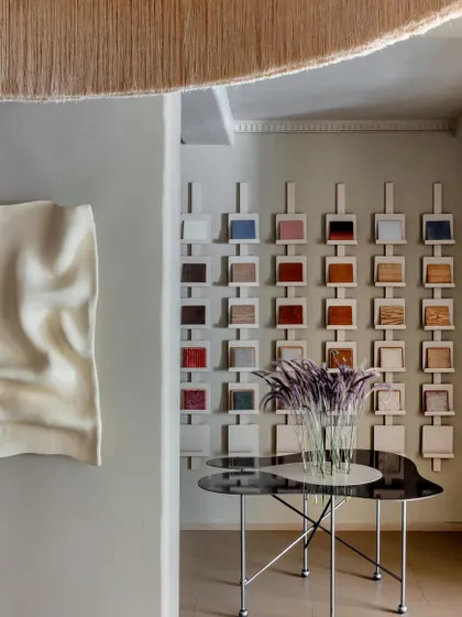 We believe a retail space should tell the story of its brand, which is why we created this interactive material library wall. It allows customers to see and touch the various finishes and fabrics available, making the design process transparent and engaging.