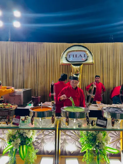 The Thai station in full swing, with chefs preparing and serving a variety of authentic dishes.