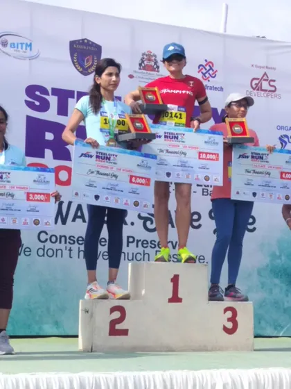 On top of the podium at the JSW Steel City Run. It's an honor to stand here and represent what's possible with dedication.