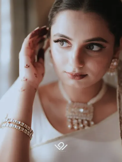 A close-up of a Muslim bride, her elegant makeup and jewelry highlighted in this beautiful portrait.