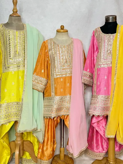 A front-on view of the Pimmo sets, highlighting the rich colors and detailed embroidery.