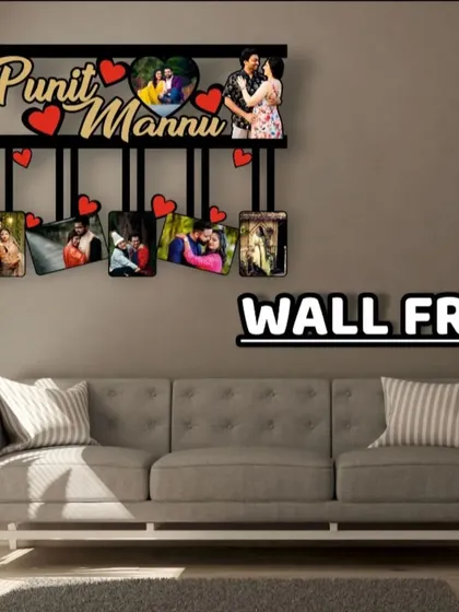 This personalized wall frame is designed for couples, featuring both their names, a heart-shaped photo, and six other pictures.