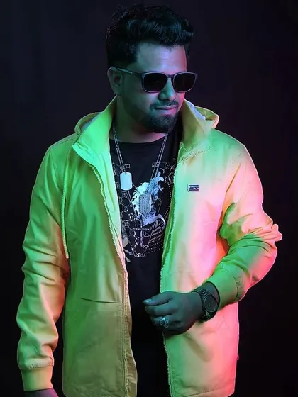A studio shot with dramatic lighting, highlighting my bright yellow jacket.