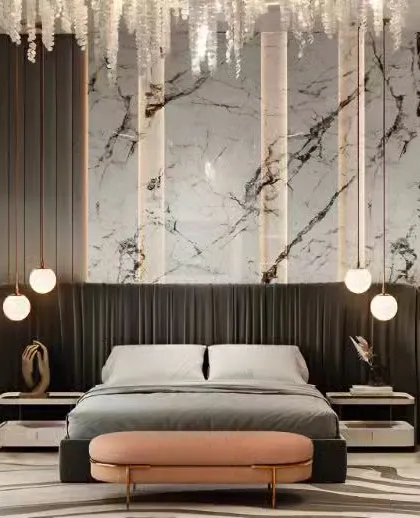 A close-up of the luxurious marble and pleated fabric headboard wall from a previous design. This image highlights the detail of the pendant lighting and the rich textures used to create a high-end hotel feel.