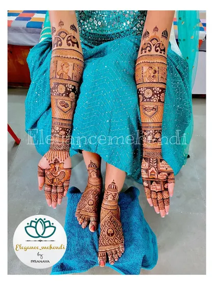 A complete bridal look, with intricate mehendi on both hands and feet, featuring elephants and other custom figures.