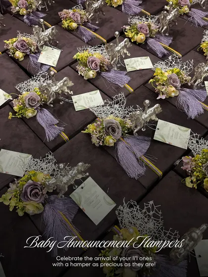 A full set of baby announcement hampers ready for delivery. Each gift is presented in a deep purple velvet box, adorned with a silver horse figurine, a floral bouquet, and a personalized card, perfect for a grand announcement.
