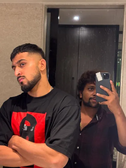 A serious look from Umran Malik, showing off the sharp cut.