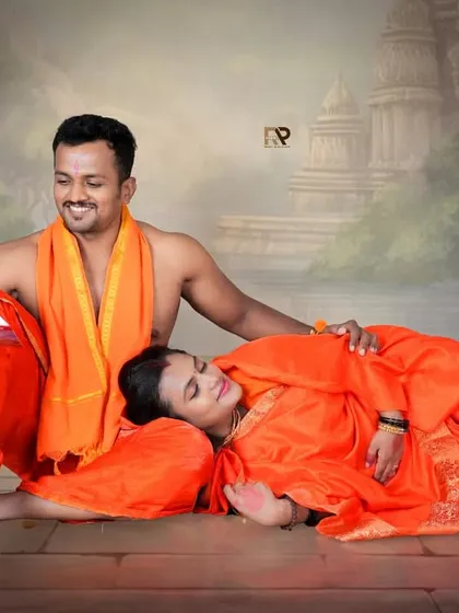 Sharing stories and dreams for the future. This pose, with the couple reading a book together, adds a narrative element to our Seetha-Ram themed shoot.