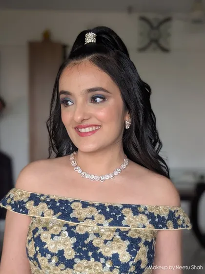 A close-up of this party-ready makeup, showing the blended smokey eye and radiant skin. It's a look that's both glamorous and age-appropriate.