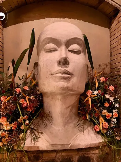 An artistic floral installation at a citrus-themed baby shower held at One8 Commune. This shows how I can integrate event decor with a venue's existing aesthetic to create something truly unique.
