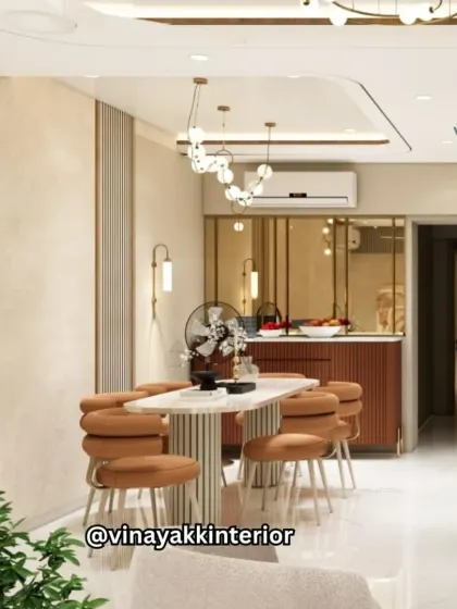 An open layout where the dining area, with its contemporary chairs and pendant lighting, is perfectly integrated with the kitchen and living spaces. This design is ideal for modern family living and effortless entertaining.