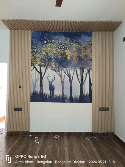 A duplicate of the deer in the forest mural, framed by fluted panels.