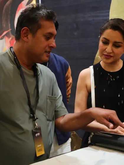 The wonderful Tisca Chopra visited our booth at the Ajio Luxe Weekend, seen here exploring our collection of wallpaper books with our founder.