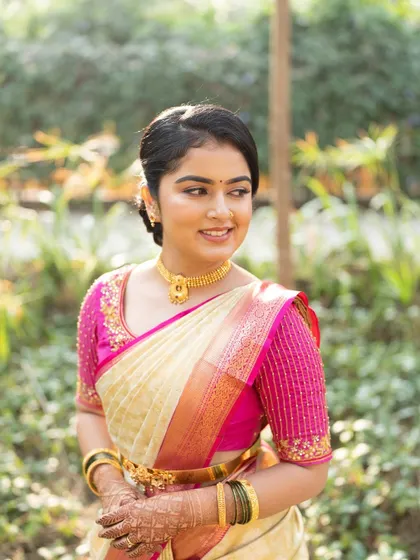 A close-up of the bride-to-be, showing her fresh makeup and happy smile.
