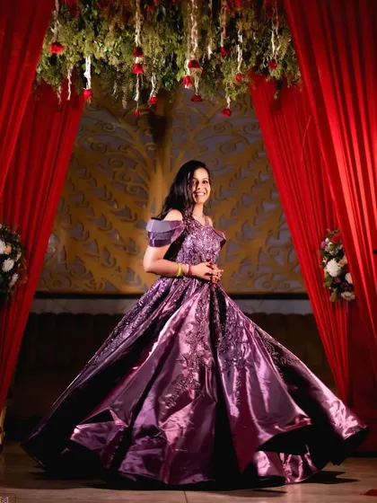 Another angle of the bride's twirl, showcasing the beautiful flow and detail of her engagement dress.