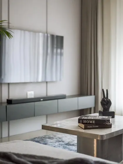 The exquisite marble-topped center table was customized on-site. It's a nod to modern sophistication and serves as a beautiful anchor for the living room seating area.