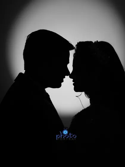 A silhouette portrait is a creative way to capture a romantic moment. This shot from an engagement session focuses on the couple's connection in a simple, artistic way.
