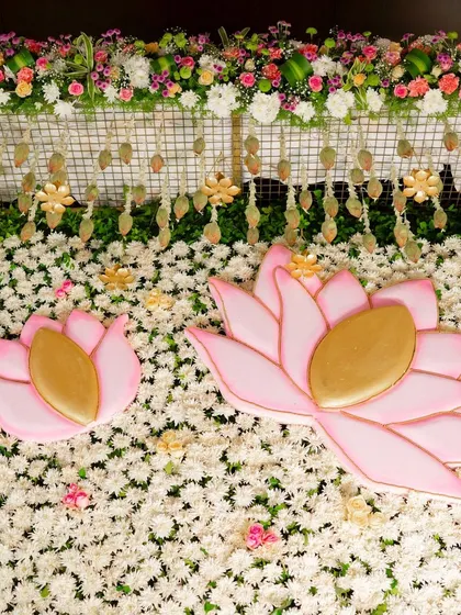 More lotus love. This close-up shows the detailed craftsmanship of the floral wall and hanging decorations for the naming ceremony, creating a beautiful and serene environment.