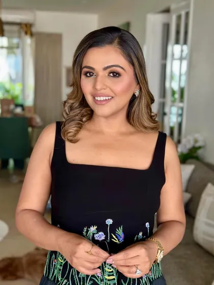 A bright, beautiful smile completes this effortlessly chic look. It's a testament to how minimal makeup can make a big impact.
