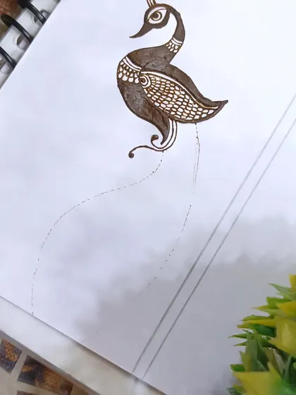 The very beginning of the peacock design, starting with the body and neck. I guide my students through each step to ensure a perfect result.