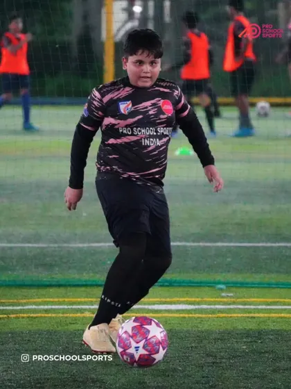 A player practices ball control, a fundamental skill for every position on the field.