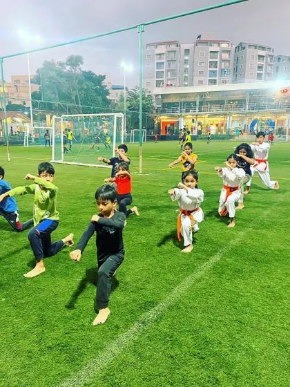 Our young students practicing their stances at the Play Arena facility. We train outdoors to build adaptability and resilience.