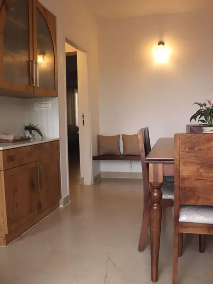 A cozy dining nook with a built-in bench and custom wooden furniture, perfect for intimate family meals.