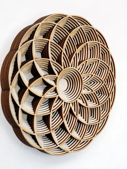 Our Geometric Flower Mandala combines natural wood tones with intricate, layered petals. This side view emphasizes the 3D construction and the beautiful contrast between the different wood finishes.