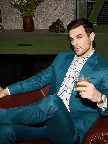 This Teal Green linen suit is a bold choice for the man who isn't afraid of color. I've paired it with a geometric printed shirt to create a look that is modern, stylish, and perfect for making a statement at a monsoon party or day event.