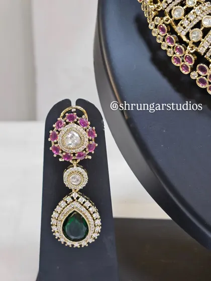 The matching earrings are designed to be statement pieces on their own.