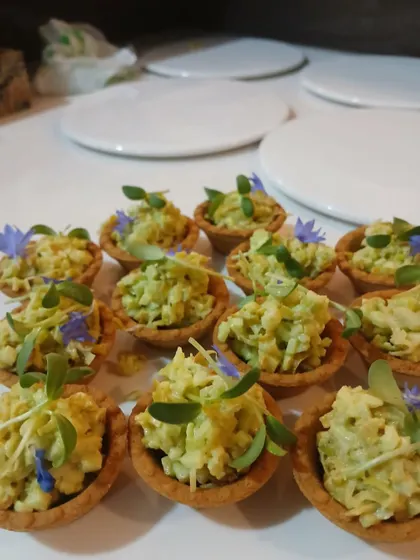 A tray of my avocado and corn tartlets, ready to be served. These are always a crowd-pleaser at my events.