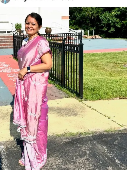 Another photo of the client at a temple, looking elegant in her custom-embroidered saree. It is an honor to be trusted with such special projects.