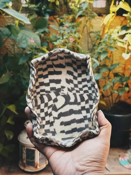 This student came in as a beginner, but her pieces look anything but. Her curious nature made her try things without overthinking, resulting in this bold and dramatic dragon jar and other wonderfully experimental pieces.
