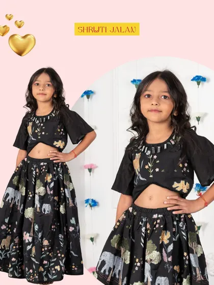 A detailed shot of my black lehenga with wildlife embroidery. The thread work on the crop top adds a beautiful texture, making this a unique and artistic piece for a special occasion.