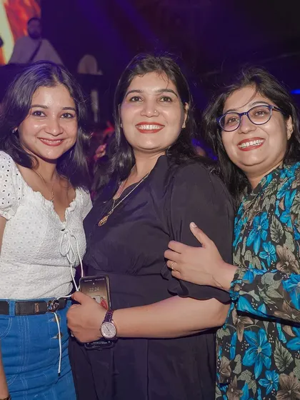 A group of friends enjoying the music and the vibrant atmosphere.