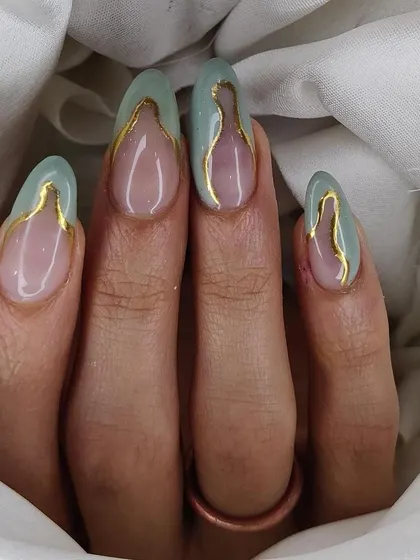 A unique abstract design with a sheer nude base, mint green color blocking, and a delicate gold chrome outline.