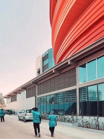 The ground floor of the MARC building features extensive glazing, creating a transparent and inviting food court area that connects visually with the outdoors.