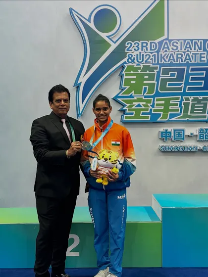 A moment of pride with Ms. Rusha Tambat after she won the silver medal for India in China. Our commitment is to provide the best technical and financial support to make these victories possible.