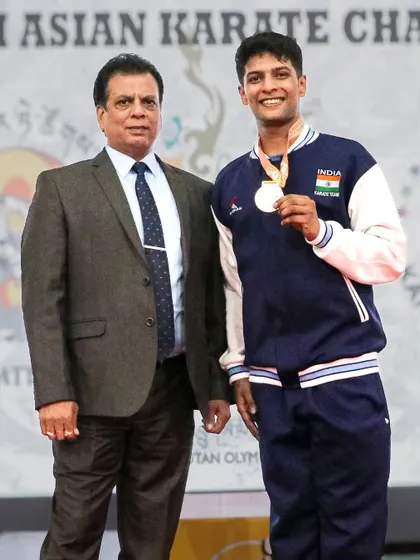 Another cherished memory, with my son Pranay after a medal win. His journey is an inspiration, and I am his proudest supporter.