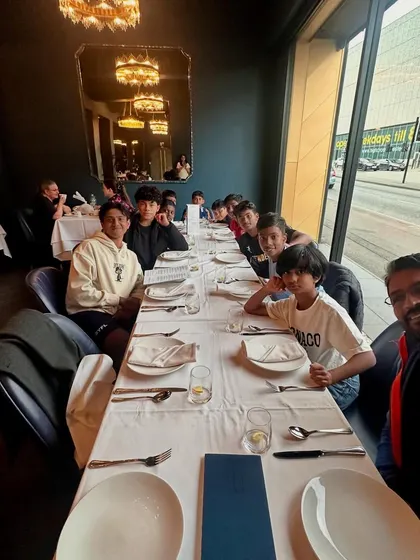 After days of international cuisine, the team enjoys a much-craved Indian meal in the UK.