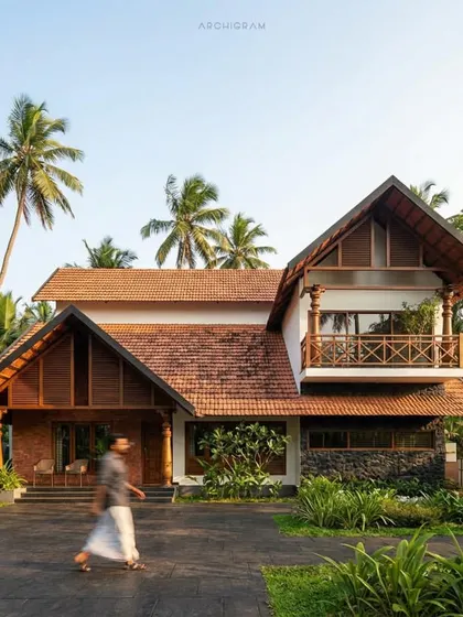 This residential project by Archigram in Malappuram is a beautiful example of traditional Kerala architecture, with its intricate woodwork, tiled roofs, and welcoming porch.