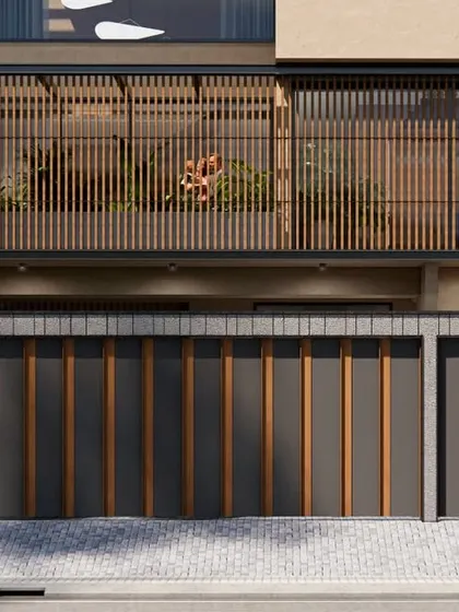 The ground level of the 18th Avenue House, showing the integration of the gate and boundary wall into the overall architectural language. The design ensures privacy from the street while hinting at the green, open spaces within.