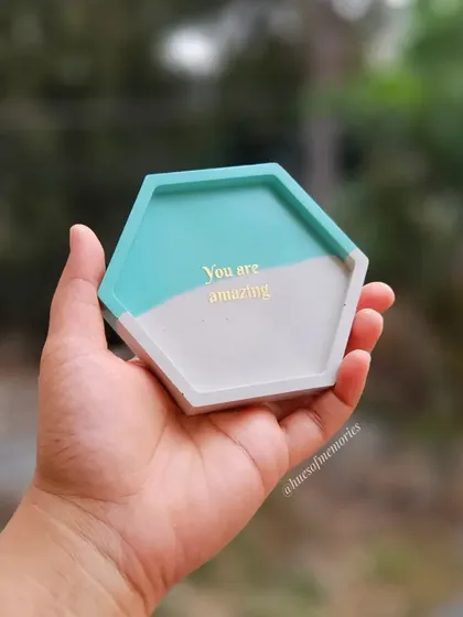 A close-up of a custom coaster with the text 'You are amazing'. These make for such a positive and beautiful return gift for guests at any event.