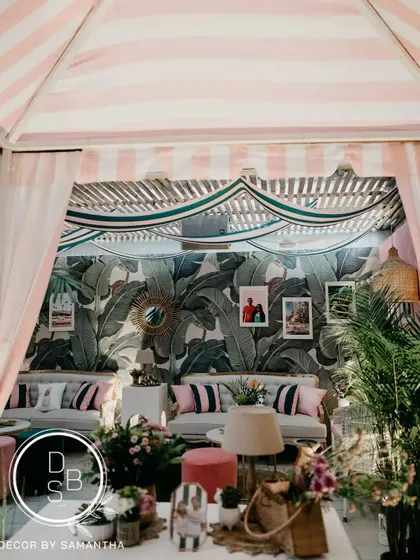 A full view of the "Hotel California" cabana, designed to be the perfect spot for guests to relax, chat, and soak in the retro vibes of the post-wedding celebration.