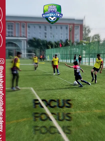 Focus in every move. A player lines up a pass during a practice match, demonstrating the concentration we teach.