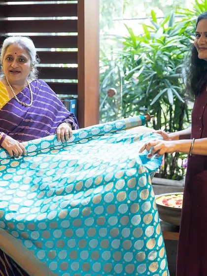 A moment from my group workshop where I am helping a student understand the texture and fall of a beautiful Banarsi saree. My classes cover how to handle different fabrics, from silk to cotton.