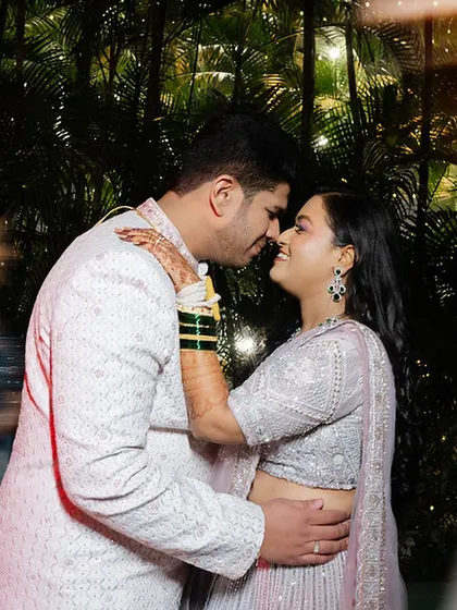 A close, romantic portrait of the couple, their faces close together, sharing a special moment.