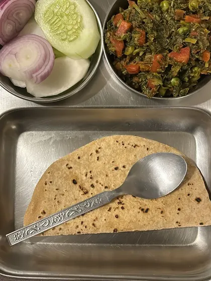 A simple and wholesome thali with roti, mixed vegetable sabzi, and a side salad. This is a typical meal for a busy school teacher on her weight loss journey.