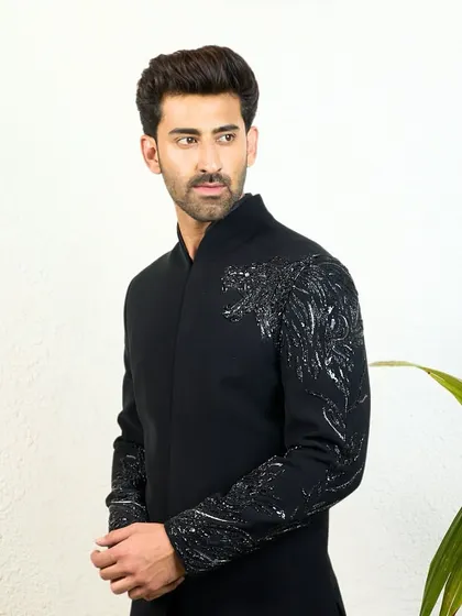 The majestic black kurta with hand-embroidered cheetah detail, shown here against a clean background to emphasize its unique and powerful design.