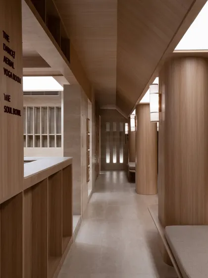 Further images from the BeWell, QBF Coffee, and Tubu projects, illustrating the consistent use of natural materials, clean lines, and thoughtful lighting to create serene and restorative commercial spaces.